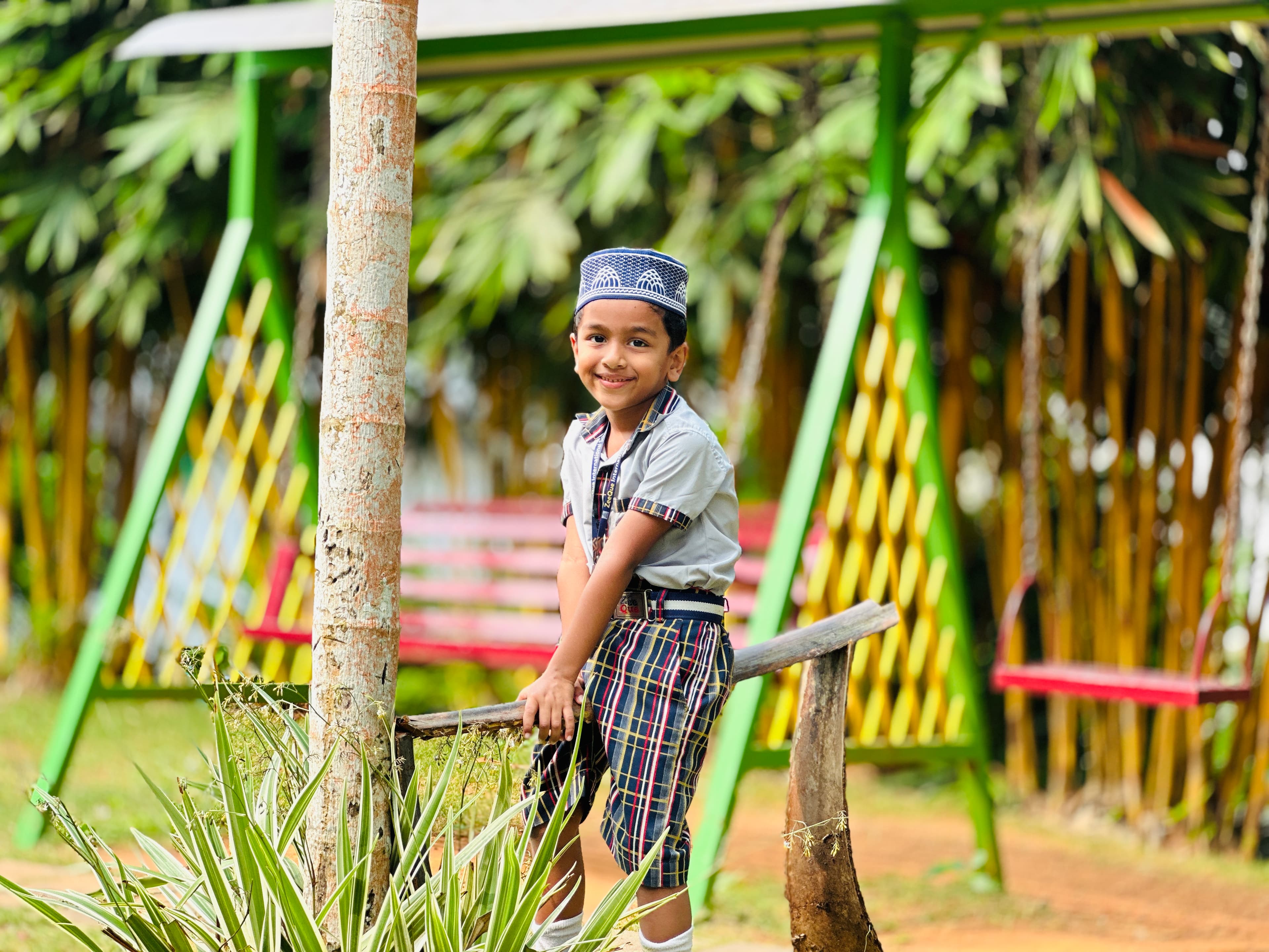 Young students reading books together in the bright Zeeque Preschool library, Kerala.