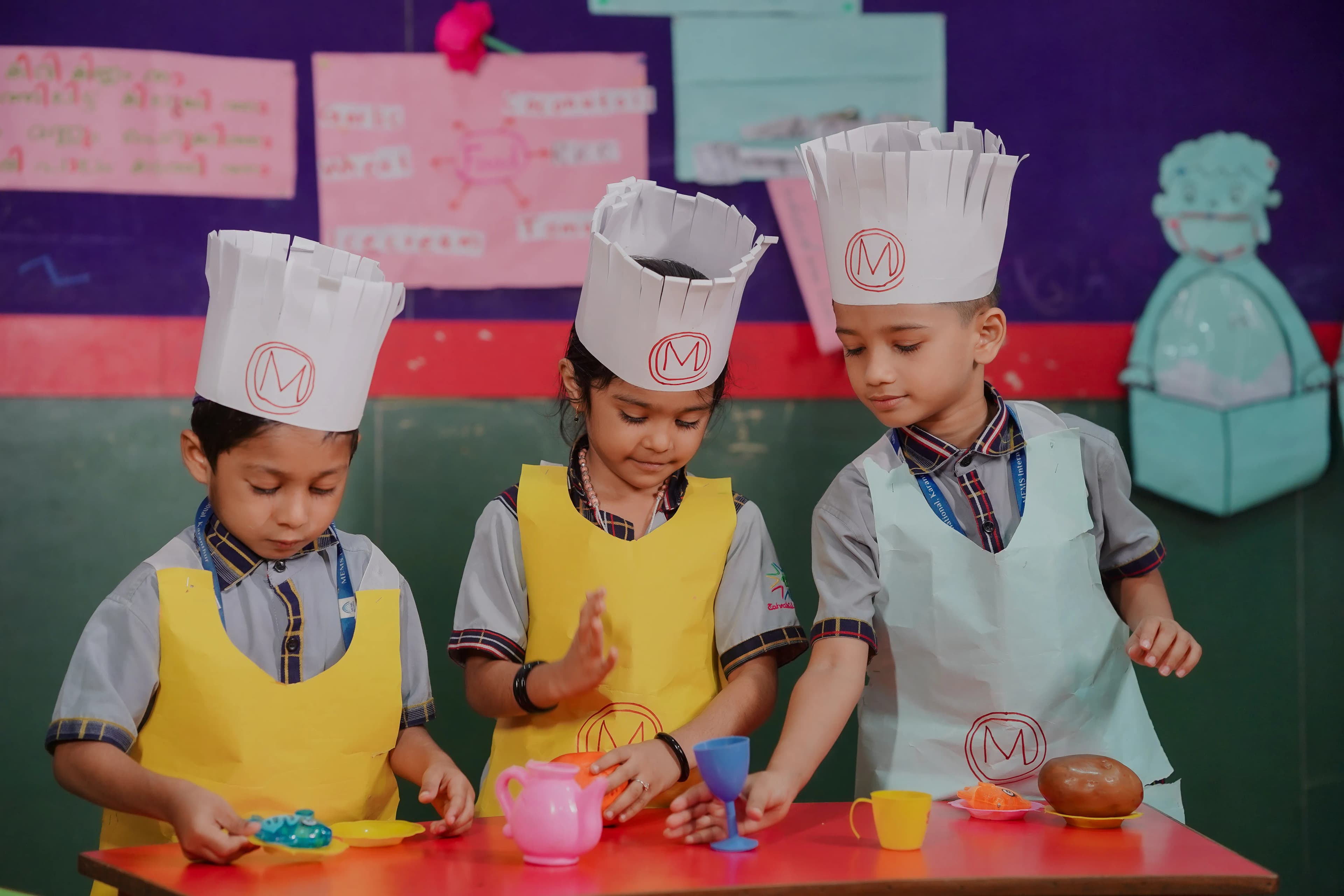 Children participating in creative arts and hands-on exploration in Kerala.